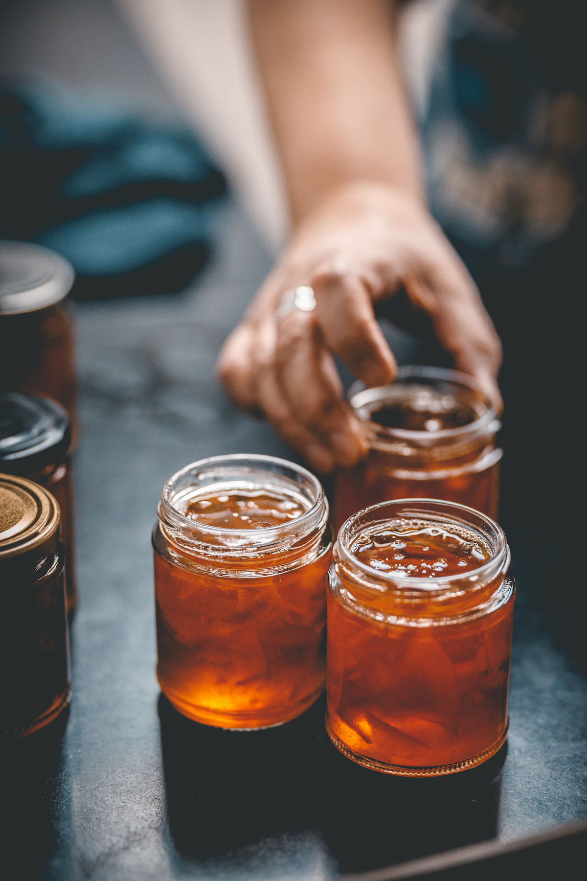 Open jars of marmalade on a table